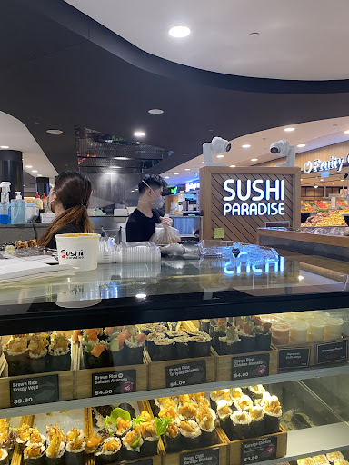 Sushi Paradise display case with prepared meals